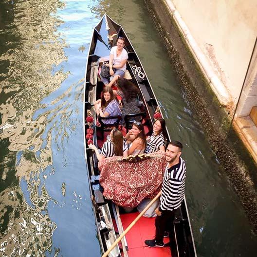 Students on a gondola in Venice, Italy